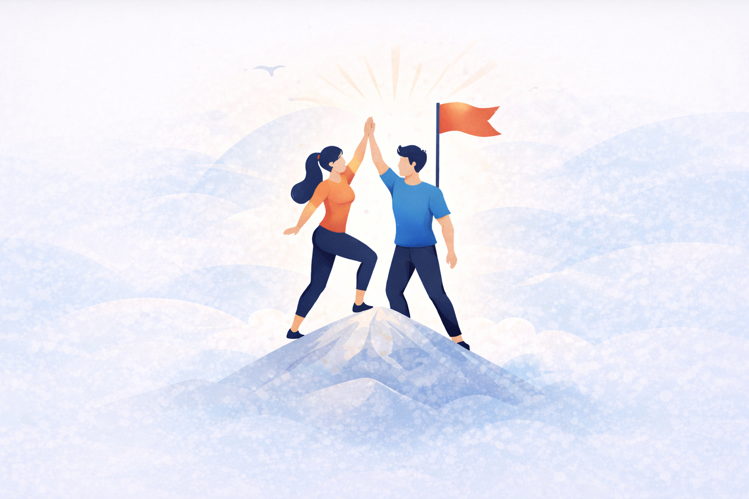 Couple celebrating shared goals with high-five on mountain